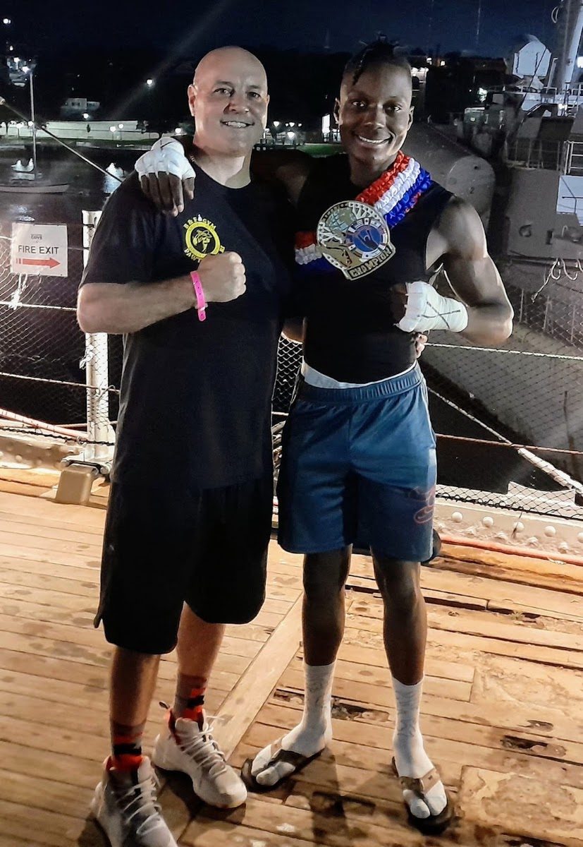 Coach Robert Clark with a Boxing N' More champion